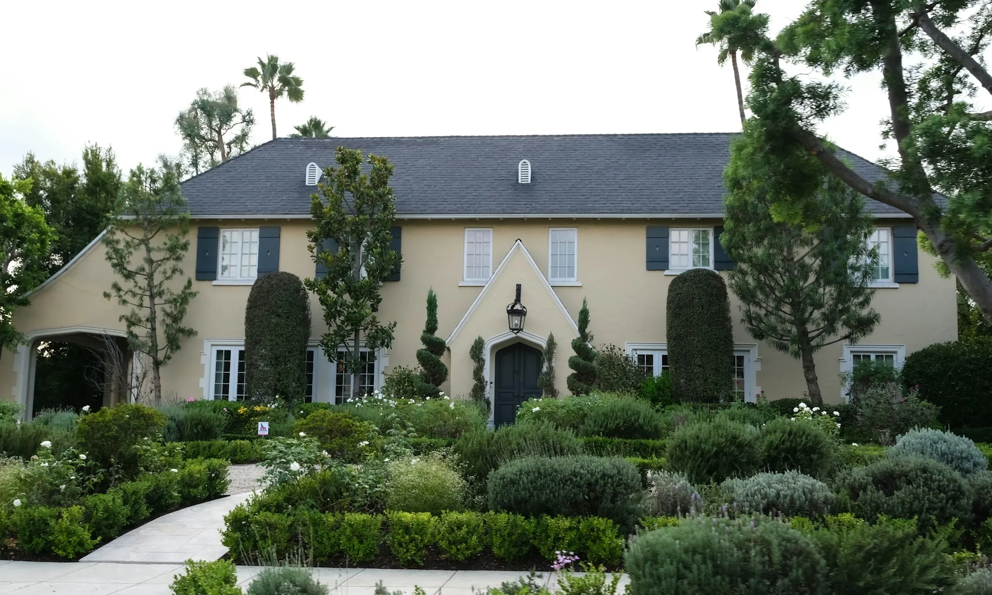 Georgian estate behind clipped hedges