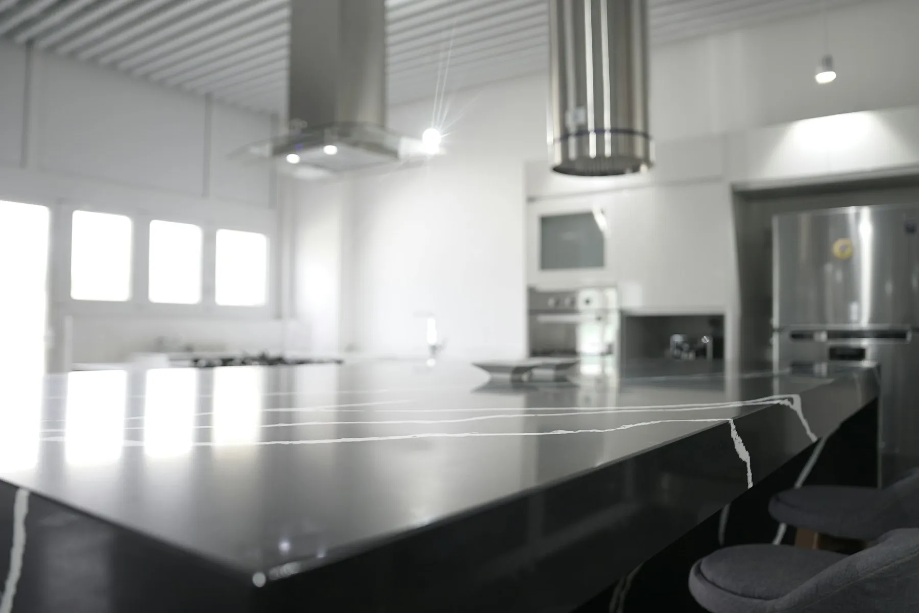 Kitchen with dark cabinetry